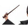 Panenka Harry Potter ve školním hábitu Gryffindor + hůlka